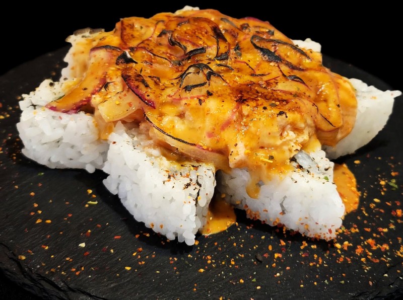 Spicy Yellowtail, Avocado Inside. Spicy Salmon, Red Onion, and Spicy Wasabi Mayo Sauce on top torch. Starfish Roll