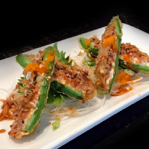 Deep fried stuffed jalapeno with spicy tuna And Deep Fried , Under seaweed salad, fish egg & special sauce San Francisco Fire (6Pcs)