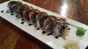 Deep fried Green Onion, Shishito on Wagyu Beef Seared w/ Oroshi Ginger, Arugular and Tataki Sauce Hanabi Roll