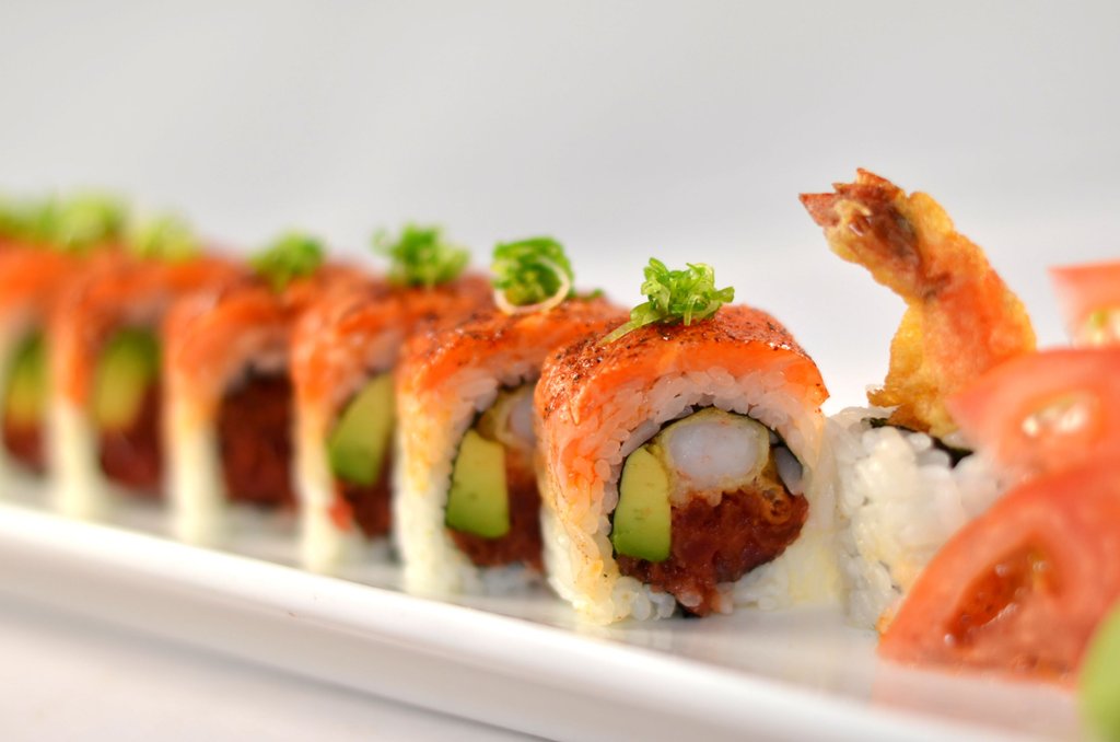 Shrimp Tempura, Crab Meat, Avocado on Seared Salmon w/ Garlic Ponzu and Green Onion Cajun Salmon Roll